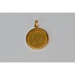 An 1899 full sovereign in a 9ct gold mount.