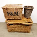 Two cane laundry baskets with a cane bin, largest 85cm x 63cm x 45cm.