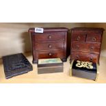 Two 19th century miniature chests of drawers, H. 18cm, together with an Indian ebony puzzle book,