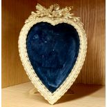 A gilt brass heart shaped photo frame, H. 19cm.