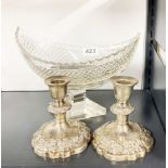 A fine cut crystal boat shaped bowl, W. 25cm, together with a pair of silver plated candlesticks,