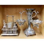 A large silver plated table centrepiece, H. 34cm, together with an oak and silver plate cruet set.
