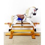A painted wooden rocking horse, L. 104 H. 89cm.