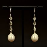 A pair of 18ct white gold (tested)pearl drop earrings set with rose cut diamonds, approx. 0.69ct