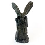 A 19th century signed bronze eagle mounted cabinet opening to reveal a gilt bronze figure of