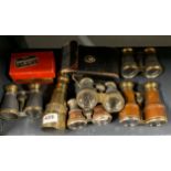 A collection of field glasses and a monocular.