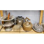 A silver plated ice bucket and other metal items.