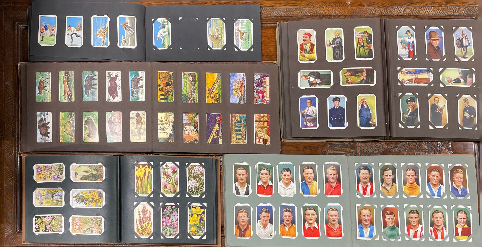 Six albums of mixed cigarette cards.