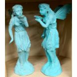A pair of cast iron garden figures of fairies, H. 50cm.