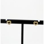 A pair of 18ct yellow gold diamond set heart shaped stud earrings, L. 6mm. With rubber backs.