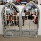 A pair of painted arched garden mirrors. H. 137cm.