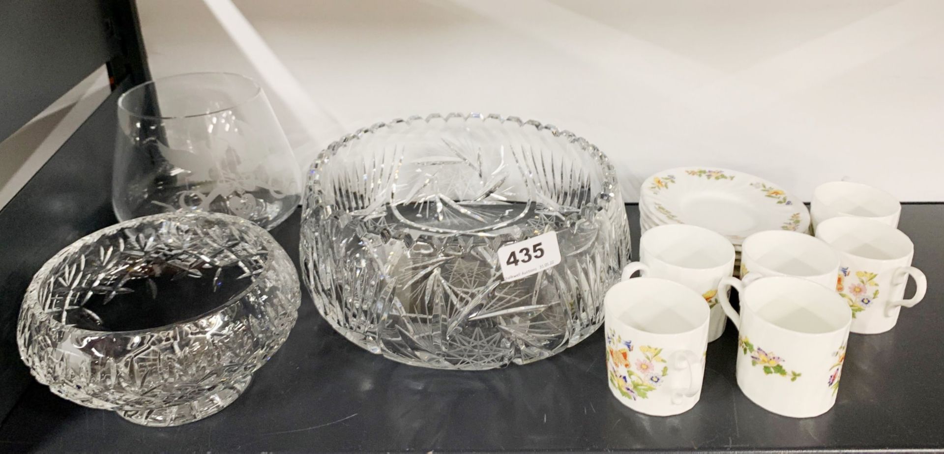 A cut crystal fruit bowl with two further cut crystal items and an Aynsley coffee set.