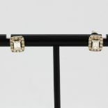 A pair of 18ct white gold stud earrings set with baguette and brilliant cut diamonds, approx. 0.5ct,