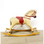 A vintage rocking horse, L. 107cm H. 72cm.