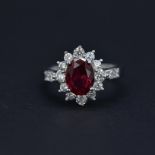 A 925 silver cluster ring set with an oval cut synthetic ruby and white stones, (P).