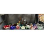 A group of mixed glass paperweights and other items.