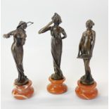 A set of three Art Deco style bronze figures of young women, H. 22cm.