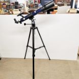 A Bresser Skylux 70/700 telescope and adjustable tripod with varies additional parts, attachments