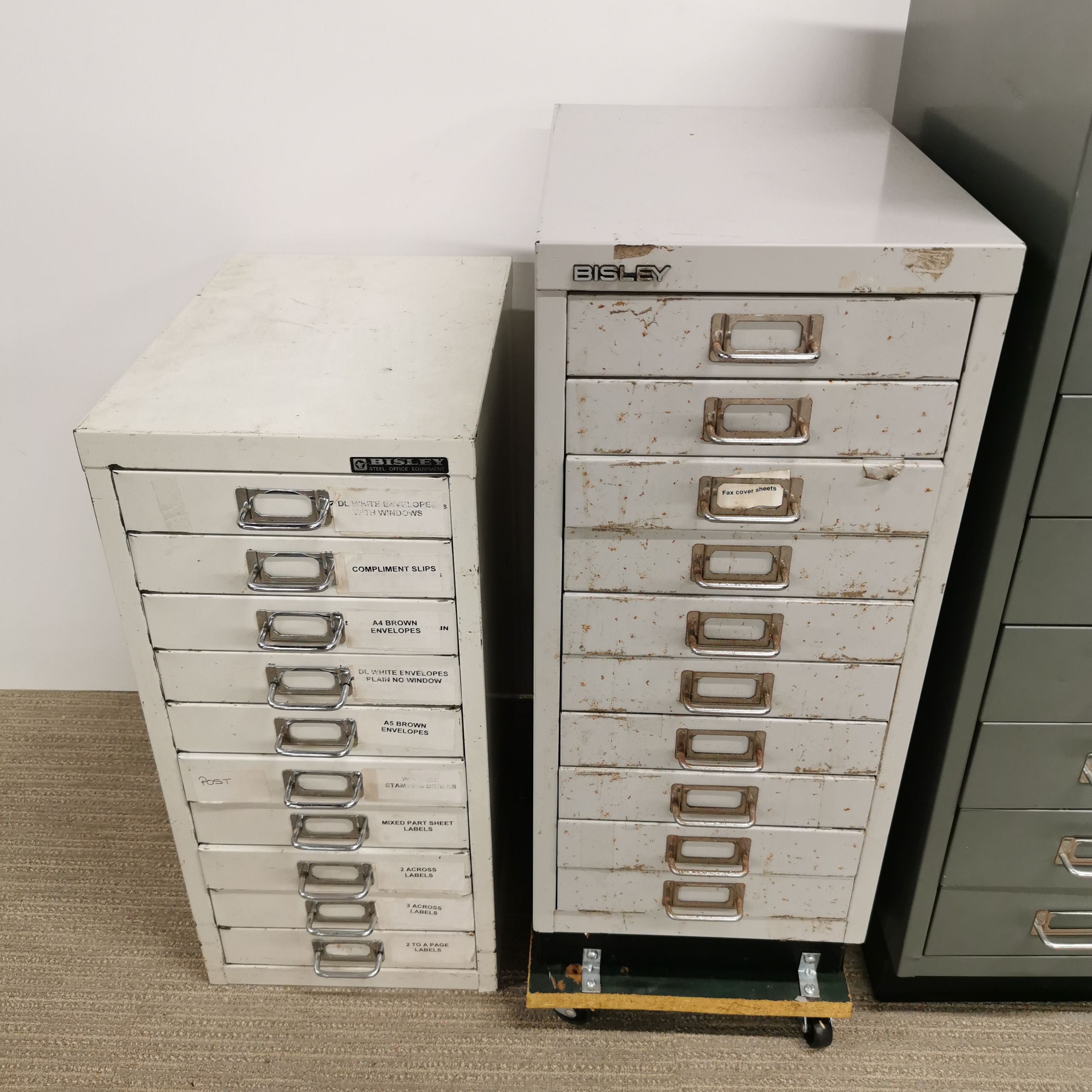 Three Bisley metal filing cabinets, one attached to platform with castors, together with a further - Image 2 of 3