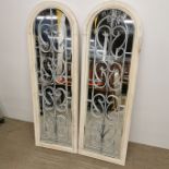 A pair of painted garden mirrors. H. 124cm.
