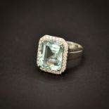 An 18ct white gold ring set with a large emerald cut aquamarine, approx. 8.63ct, 1.5 x 1cm,