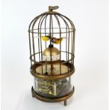 An amusing Chinese bird cage clock, H. 18cm.