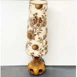 A 1970's German ceramic floor lamp with original shade, overall H. 126cm. Some cracking to body of