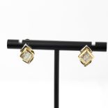A pair of 9ct yellow and white gold earrings set with princess cut diamonds, L. 1.2cm.