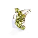 A 925 silver ring set with oval cut peridots.