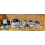 A quantity of mixed inkwells and other desk items.