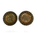 A pair of 19th century continental bronze wall plates, dia. 20.5cm.