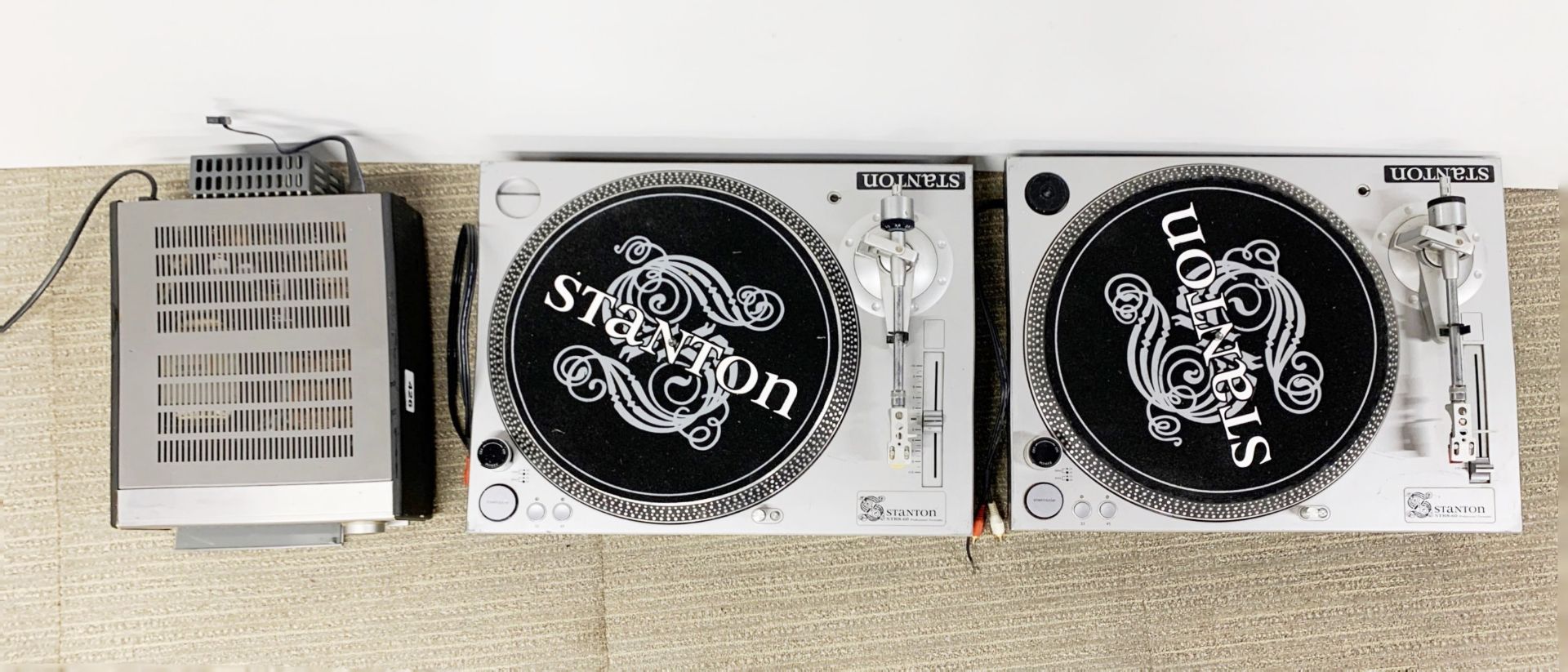 Two Stanton STR8-60 record turntables and a Denon compact disc player.