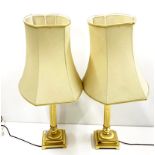 A pair of gilt brass column table lamps with shades, H. 80cm.