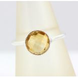 A 925 silver ring set with faceted cut citrine, (O).