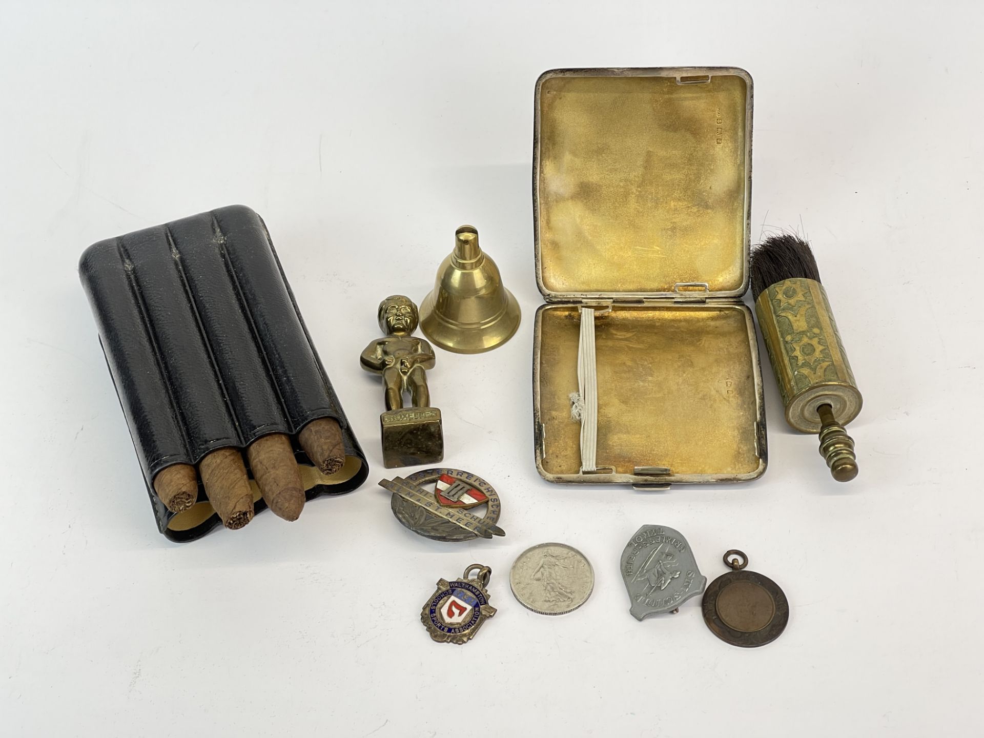 A hallmarked silver cigarette case and other small items.