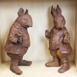 A pair of cast iron Beatrix Potter garden figures, H. 44cm.