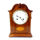 An Edwardian inlaid striking mantel clock, H. 33cm.