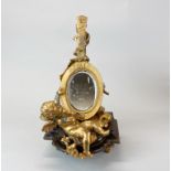 A gilt bronze and marble cherub and lute desk mirror, H. 29cm.