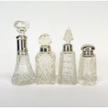 A group of four hallmarked silver mounted cut glass dressing table bottles, tallest 13.5cm.