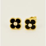 A pair of 18ct yellow gold (marked 18K) onyx stud earrings each set with a brilliant cut diamond, L.