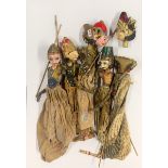 A group of five Indonesian carved wooden puppets, H. 60cm.