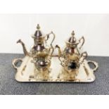 An ornate silver plated tea set and tray, tray W. 59cm.