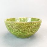 A superb Chinese green glazed and relief decorated bowl, Dia. 27cm. H. 12cm.