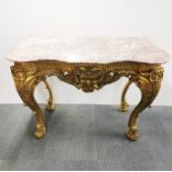 A carved, gilt composition rococo style console table with a serpentine fronted marble top, 128 x 90