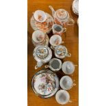 A Japanese hand painted porcelain tea set and a further part tea set.