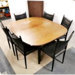 An extendable 1960's G-Plan dining table with one leaf together with a set of six G-Plan dining