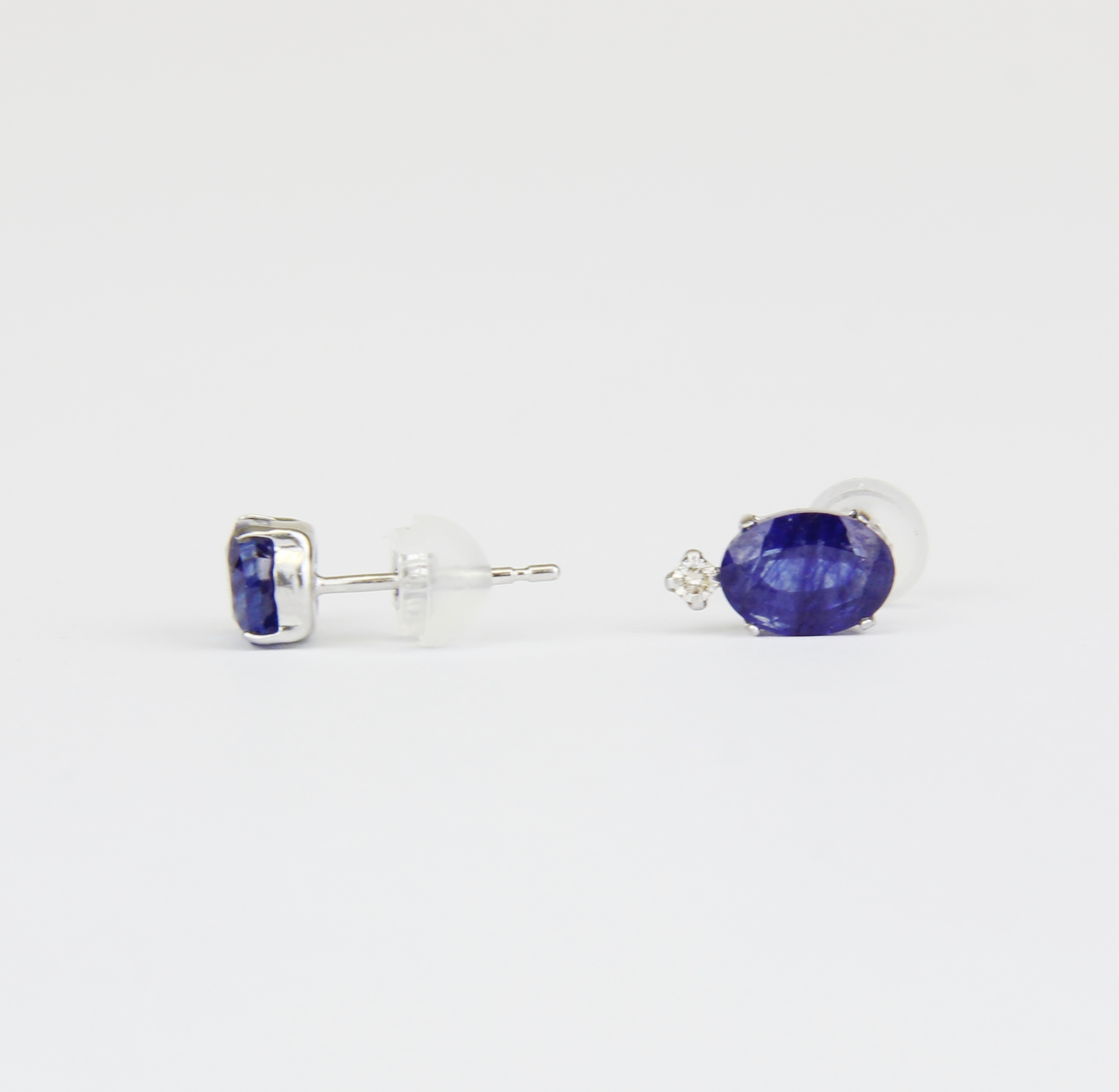 A pair of 18ct white gold sapphire and brilliant cut diamond set stud earrings, L. 1cm. With plastic - Image 3 of 3