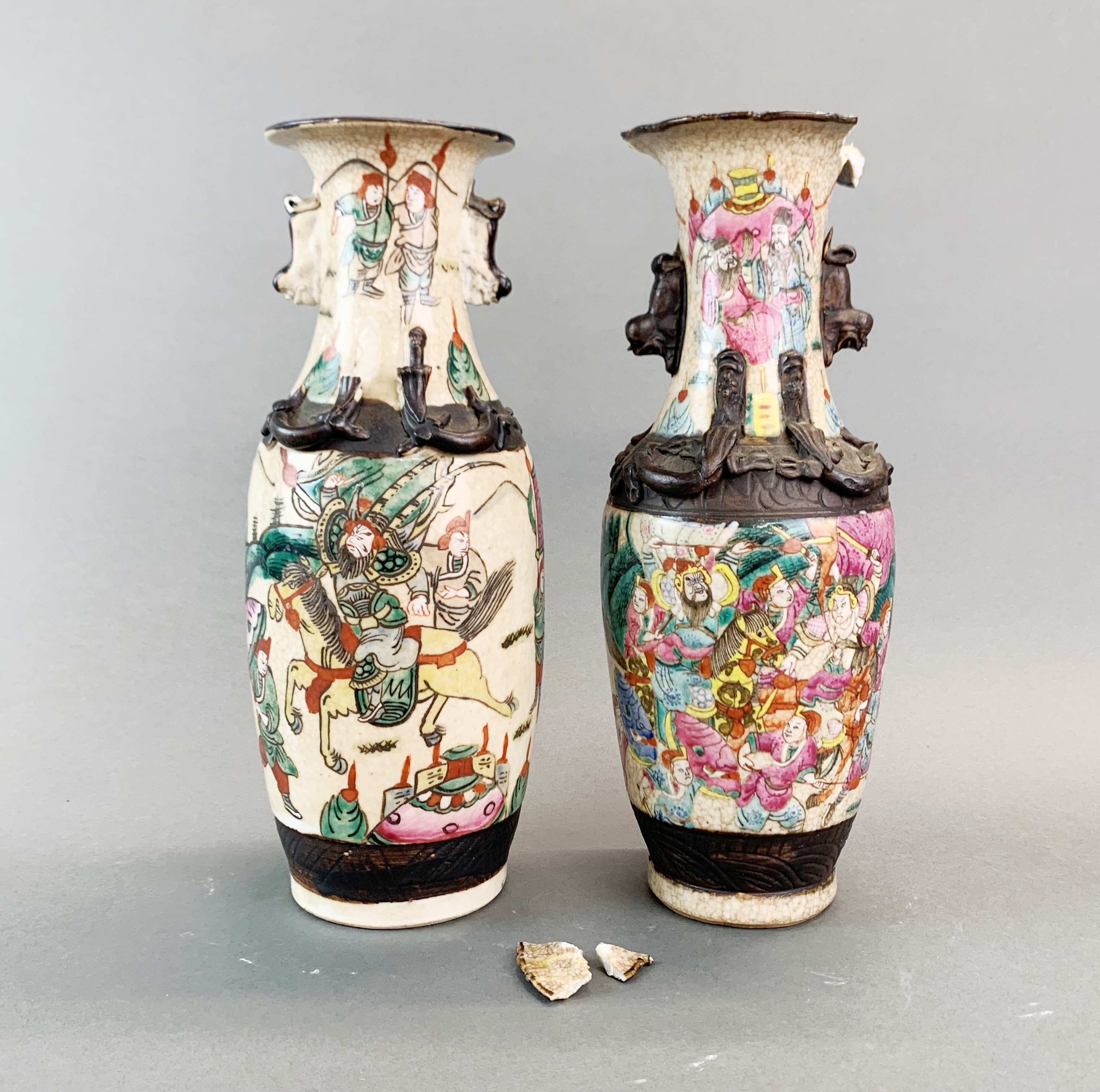 Two 19th Century Chinese hand enamelled porcelain vases, H. 30cm. One A/F to rim.