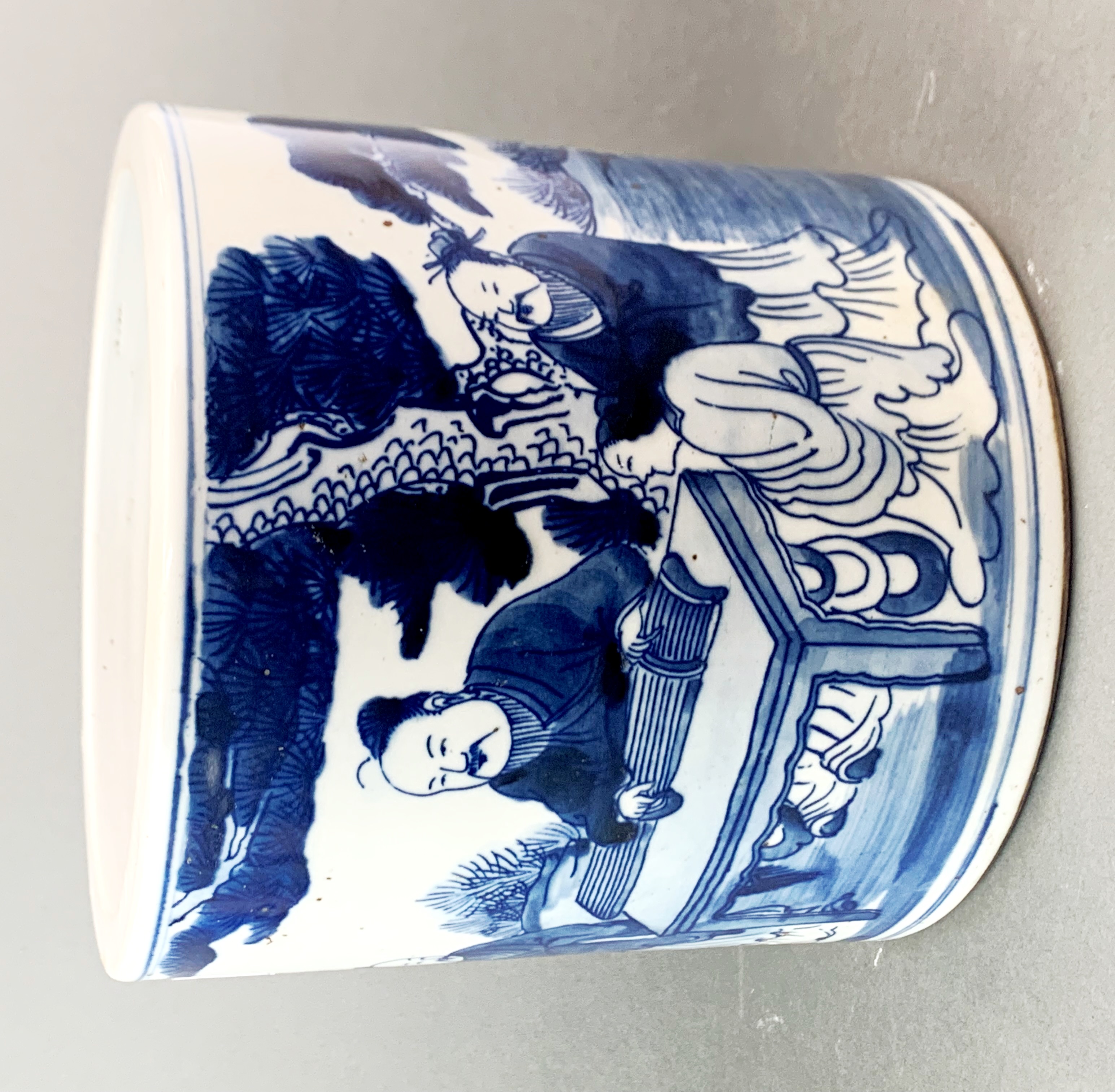 A 19th/ 20th Century Chinese hand painted porcelain brush pot decorated with scholars and a
