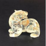 A Chinese Peking clear glass figure of a tiger, L. 6cm. H. 4cm.